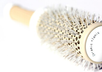 Brushing comb for styling and straightening hair. Professional tool for a hairdresser stylist.