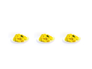 Kerala Style Cooked Yellow Tapioca In Three Plate. Selective Focus