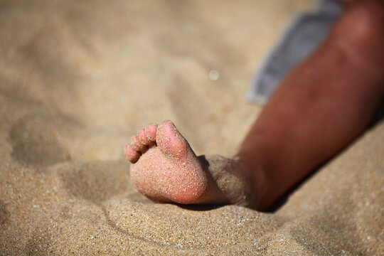 Pied dans le sable
