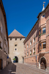 Fototapeta na wymiar Via Malles, one of the main streets in the historic center of Glurns, leading up to the north gate, South Tyrol, Italy
