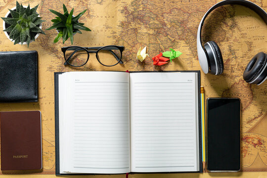 Travel accessories on a wooden desktop,Set for travel on the map background.