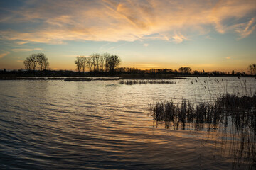 Beauty sunset clouds on a peaceful lake