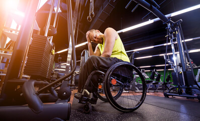 Fototapeta na wymiar Disabled man training in the gym of rehabilitation center