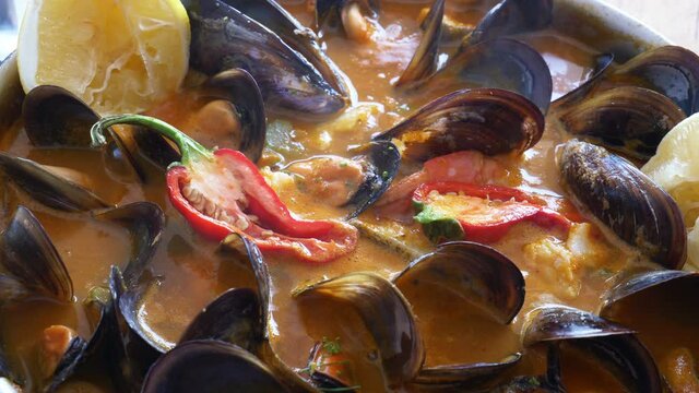 Delicious Mediterranean seafood soup with a variety of mixed 