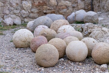 Large and heavy cut stones of the correct round shape, old stone cores for the defense of the fortress