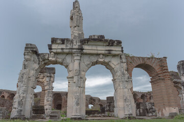 Obraz premium Roman amphitheater, ancient ruins, view of the city of Santa Maria Capua Vetere. Italy. Rainy day.