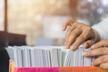 Document or paperwork,report file information in tax audit searching by businesswoman in office concept: Business people working of arranging of financial folder,check accounting budget storage in box