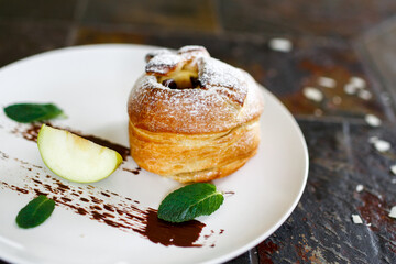 Baked apple in puff pastry with chocolate