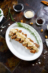 Veal medallions with nut sauce