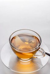 Close-up a cup of freshly brewed hot tea in a glass