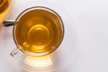 Top-view a cup of freshly brewed hot tea on the white background