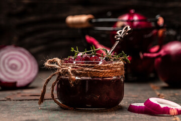 Onion jam, confiture, chutney on rustic wooden table, Preserving ingredients