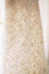 Close-up of bridesmaid dress pattern floral texture on light background.
