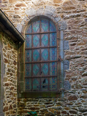old window in the wall of the church
