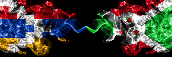Nagorno-Karabakh, Artsakh vs Burundi, Burundian smoky mystic flags placed side by side. Thick colored silky abstract smoke flags
