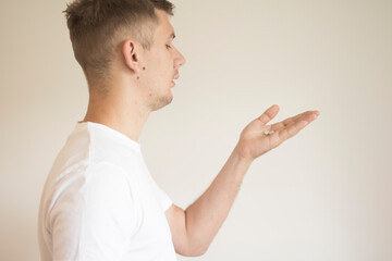 A young guy drinking pills