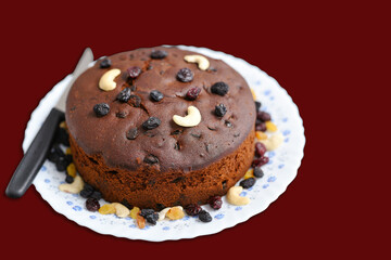 Christmas plum cake in Kerala, Indian Christmas celebration, Homemade cake. Fruitcake made with dried fruit, nuts, spices and rum for New Year party, Easter etc.
