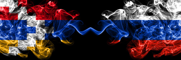 Nagorno-Karabakh, Artsakh vs Russia, Russian smoky mystic flags placed side by side. Thick colored silky abstract smoke flags