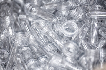 Preforms for making PET plastic bottles. Raw material Line factory manufacturing industrial