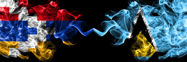 Nagorno-Karabakh, Artsakh vs Saint Lucia smoky mystic flags placed side by side. Thick colored silky abstract smoke flags