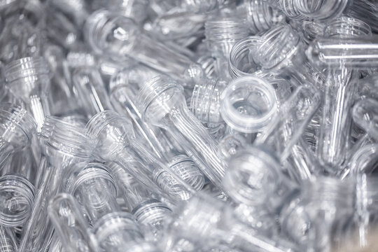 Preforms for making PET plastic bottles. Raw material Line factory manufacturing industrial