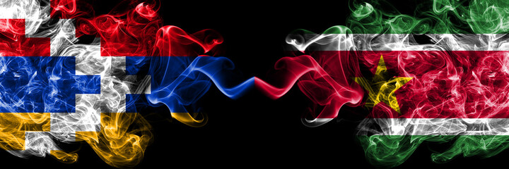 Nagorno-Karabakh, Artsakh vs Suriname, Surinamese smoky mystic flags placed side by side. Thick colored silky abstract smoke flags