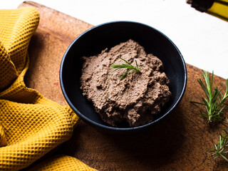 Preparing liver pate. Rustic home cooking in natural light.
