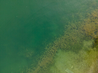 Drone shot over water. Background of lake. Birds view. Copy Space