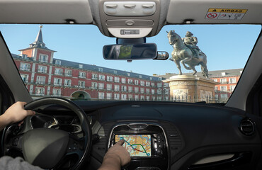Driving while using navigation system in Plaza Mayor, Madrid, Spain