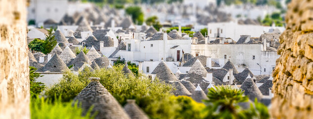 Fototapeta premium Scenic view of Alberobello and trulli, Italy. Tilt-shift effect applied