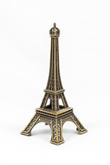 Fototapeta na wymiar Bronze Eiffel Tower model, isolated on white background
