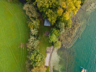 Drone shot of pasture near a lake. Copy space. Switzerland