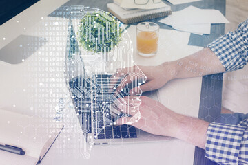 Man with computer background with brain theme hologram. Concept of brainstorm. Double exposure.