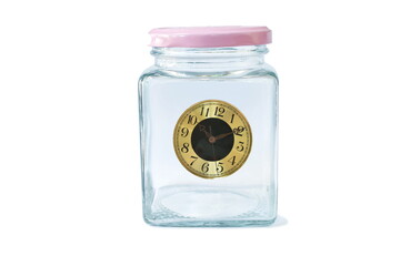 golden circle time clock floating in glass bottle on white background