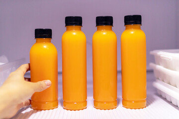 Bottle of orange juice in refrigerator get ready for summer.