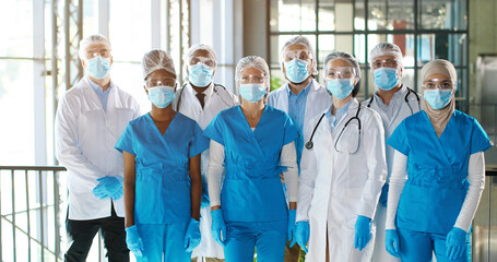 Team of mixed-races team of professional males and females doctors in hospital. Indoor....
