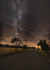 Countryside road under sky full of stars