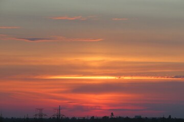 Beautiful fiery red sunset over the city, natural sky background