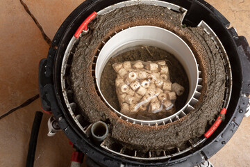 cleaning a dirty aquarium filter