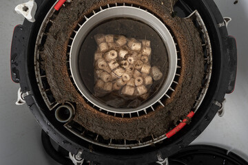 cleaning a dirty aquarium filter