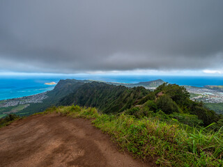 The view overlooking the town.  Blue sky over green mountains. Amazing view of the ocean. 
 Kuliouou Ridge Trail, Hawaii, Oahu