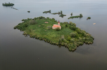 Medieval church on island in middle of lake
