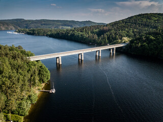Bridge over lake with yacht club