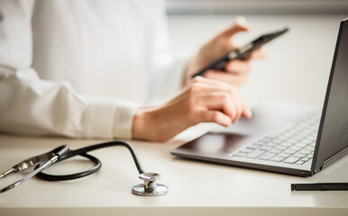 hands of doctor working on laptop tele medicine concept