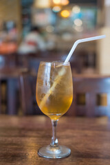 Iced tea with ice refreshing drink on wooden table