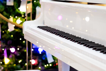 Closeup white piano with light on background