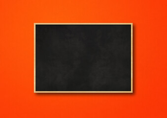 Traditional black board isolated on a red background