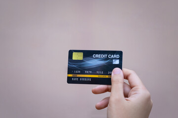 Close up of female hand holding a credit card in hand