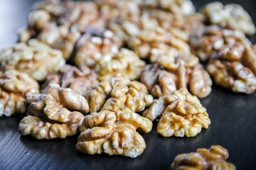 Walnut kernels on a black table