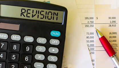 Revision, text on the calculator. Graphs and pen on white background